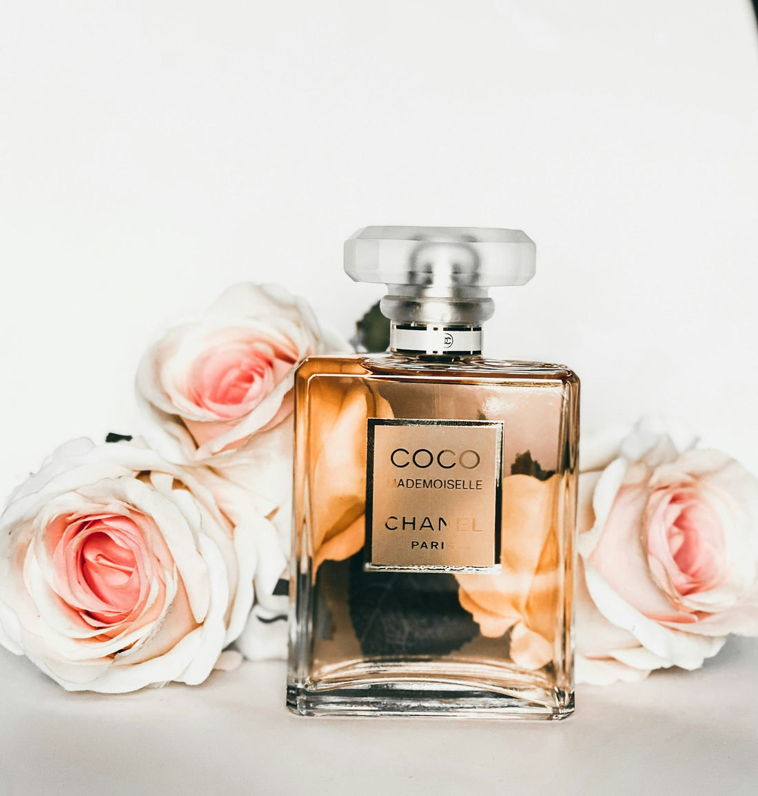 A row of designer-inspired perfume dupes on a marble surface